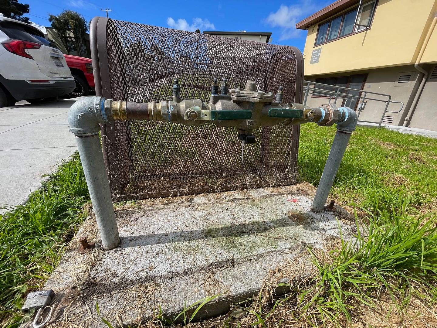 Image: Fairfield Backflow Testing logo featuring a shield emblem with water droplets, symbolizing protection and water safety.