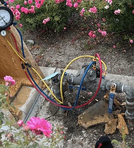 Plumber conducting backflow testing in San Francisco.