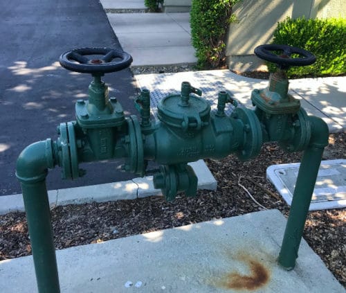 Plumber performing backflow testing in Livermore.