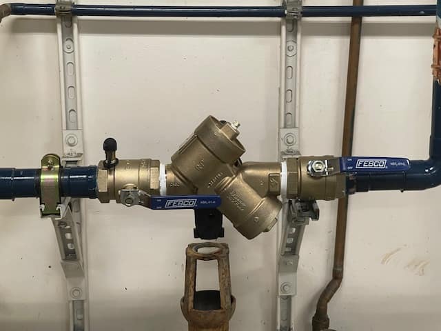 Image: A technician conducting backflow testing in South San Francisco, ensuring water safety and compliance.
